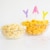 Annie's Organic Cheddar Cheesy Smiles Baked Corn Puffs Perspective: left