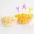 Annie's Organic Cheddar Cheesy Smiles Baked Corn Puffs Perspective: left