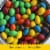 M&M'S Almond Milk Chocolate Candy Sharing Size Bag Perspective: left