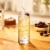 Jim Beam Red Stag Black Cherry Liqueur with Kentucky Straight Bourbon Whiskey Perspective: left