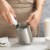 Zulay Kitchen Stainless Steel Frothing Pitcher 32oz Perspective: left