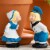 Gardens Alive! Minature Kissing Dutch Couple Garden Statues Perspective: left