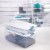 Sterilite 25 Quart Capacity Clear Plastic Storage Tote Bins with Lids, (12 Pack) Perspective: left