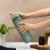 Manna™ Push Bottle Plastic- Green Perspective: left