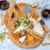 Bamboo Cheese Board and Knife Set - 10 Inch Swiveling Charcuterie Board with Slide-Out Drawer Perspective: left