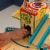 KidKraft Wash N Go 3 Tier Wooden Toy Truck and Car Garage Play Set, Multicolor Perspective: left