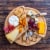 Bamboo Cheese Board and Knife Set - 14 Inch Swiveling Charcuterie Board with Slide-Out Drawer Perspective: left