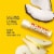 Burt's Bees Coconut and Pear Moisturizing Lip Balm Perspective: left