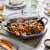 Staub Cast Iron 3.5-qt Braiser with Glass Lid - Grenadine Perspective: left