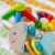 HABA Wooden Clutching Toy Rattlefish (Made in Germany) Perspective: left