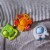 HABA Popping Flower Silicone Teething & Clutching Toy Perspective: left