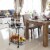 Glitzhome Metal Bar Carts, 2-Tier Mirrored Glass Top Tray Serving Cart with Universal Wheel Perspective: left