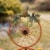 Glitzhome Bicycle Wheel Pumpkin Porch Sign for Harvest Thanksgiving Decor Perspective: left