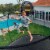 Springfree Trampoline Kids Outdoor Large Oval 8 x 13' Trampoline with Enclosure Perspective: right