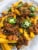 Curly's Bold & Spicy Barbecue Sauce with Pulled Pork Perspective: right
