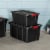 Sterilite 27 Gallon Durable Rugged Industrial Tote w/Red Latches, Black (8 Pack) Perspective: right