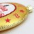 Northlight 4  Gold and Red Tootsie Roll Sugar Babies Caramel Candies Disc Christmas Ornament Perspective: top