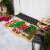 Northlight Red and Green Santa Stop Here Outdoor Christmas Doormat 18 x 30 Perspective: top