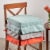 Noble House Belden Indoor Fabric Classic Skirted Chair Cushion in Coral Orange Perspective: top