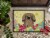 Carolines Treasures BB6102MAT Easter Eggs Pekingese Tan Doormat 18x27 Perspective: top