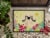 Carolines Treasures BB6106MAT Easter Eggs Pekingese Cream Doormat 18x27 Perspective: top