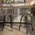 Amisco Brisk 29  Distressed Wood Swivel Bar Stool in Beige/Gun Metal Perspective: top