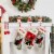 Glitzhome 6.5 Inch Tall Set of Three Resin Santa, Snowman, Penguin Stocking Holder Perspective: top